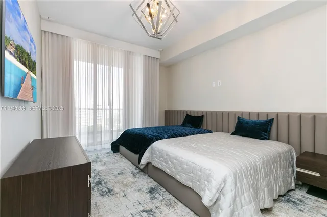 a front view of multi story residential apartment building with yard