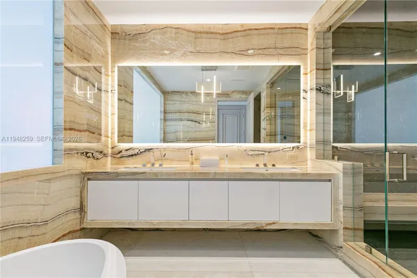 a bathroom with a bathtub and a sink