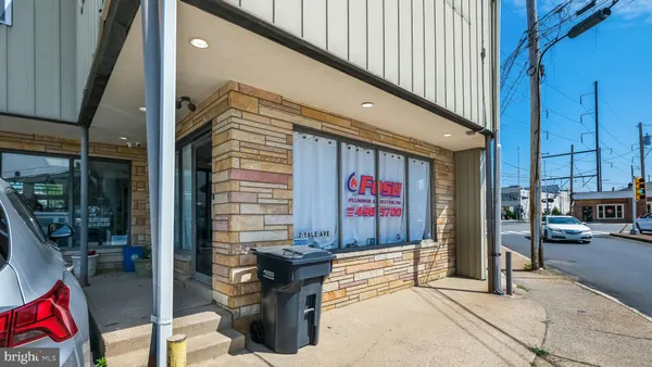 a front view of a building with sign board