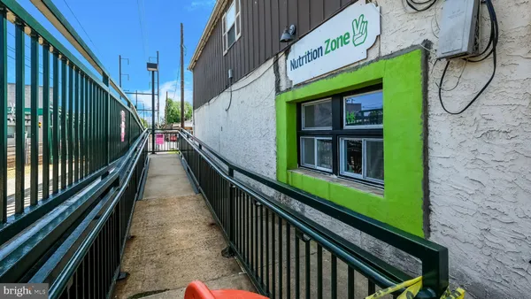 a view of a balcony with wooden stairs