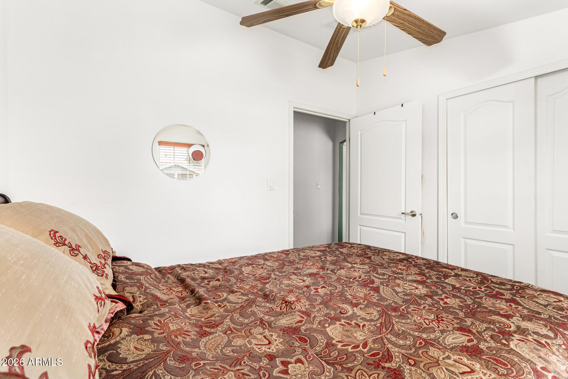 201 South Greenfield Road, Unit 90 Mesa, AZ 85206 - Photo 23 of 32 a bedroom with a bed and a painting on the wall