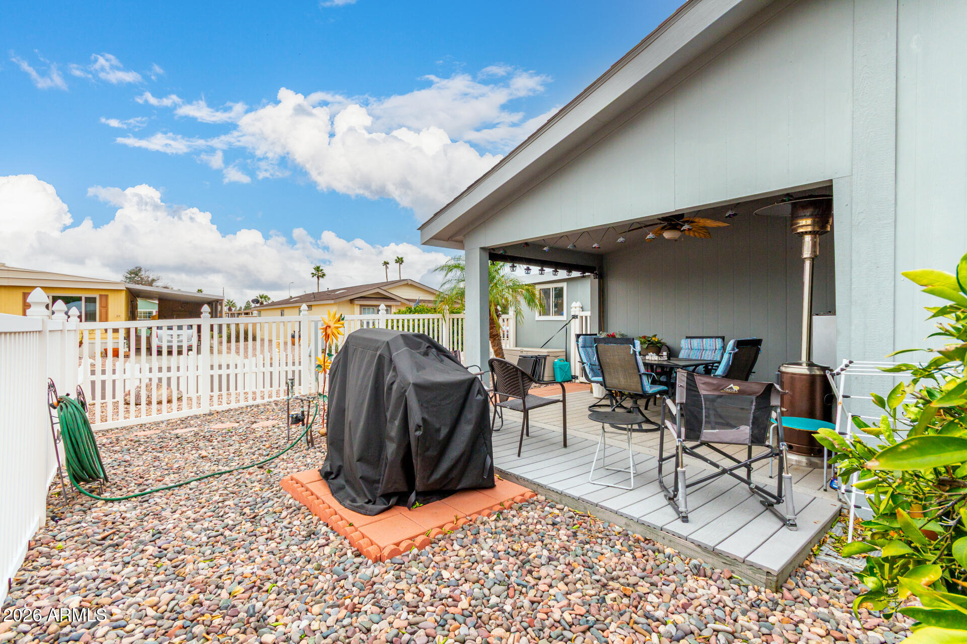 201 South Greenfield Road, Unit 90 Mesa, AZ 85206 - Photo 30 of 32 a view of a porch with furniture and a backyard
