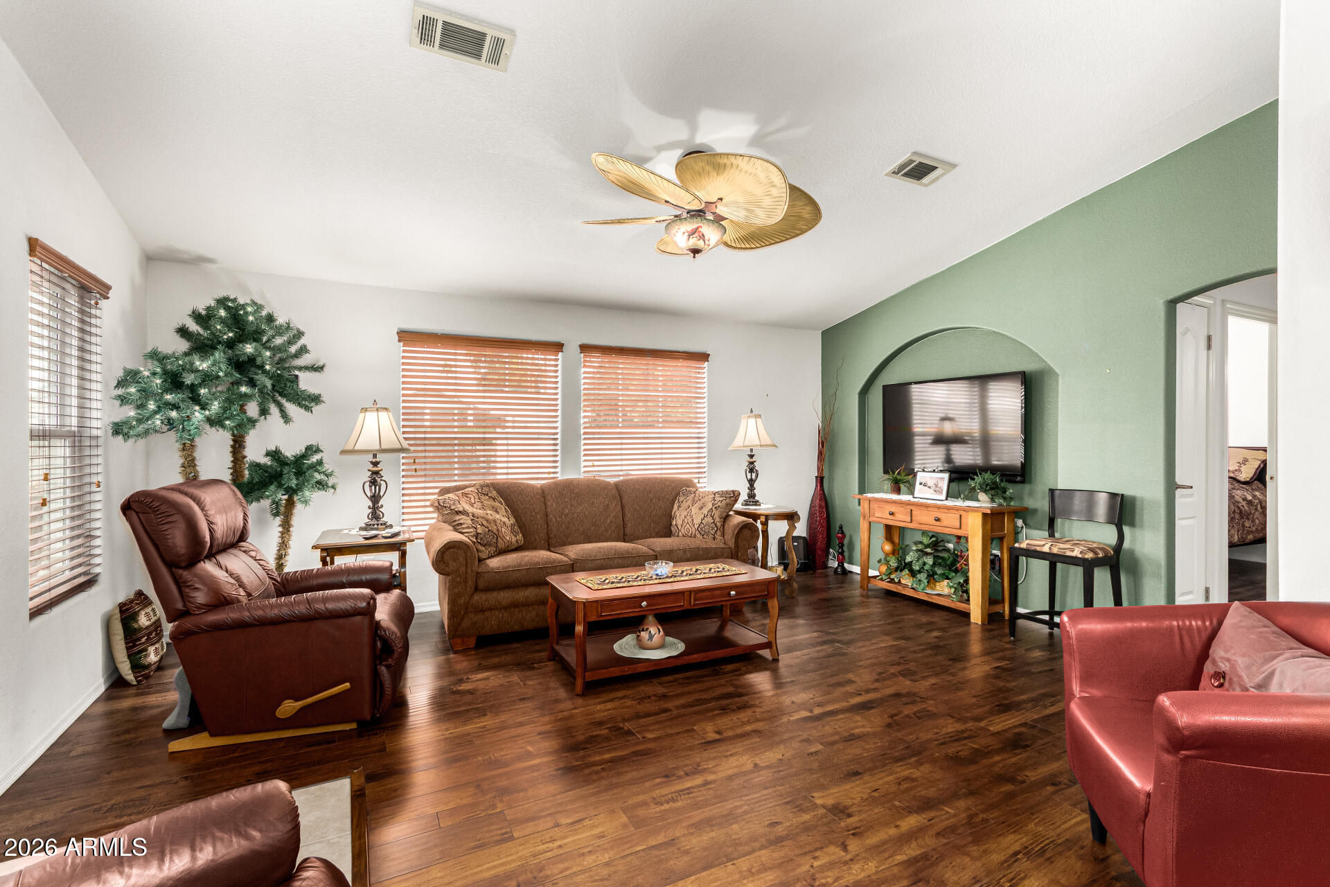 201 South Greenfield Road, Unit 90 Mesa, AZ 85206 - Photo 6 of 32 a living room with furniture and wooden floor