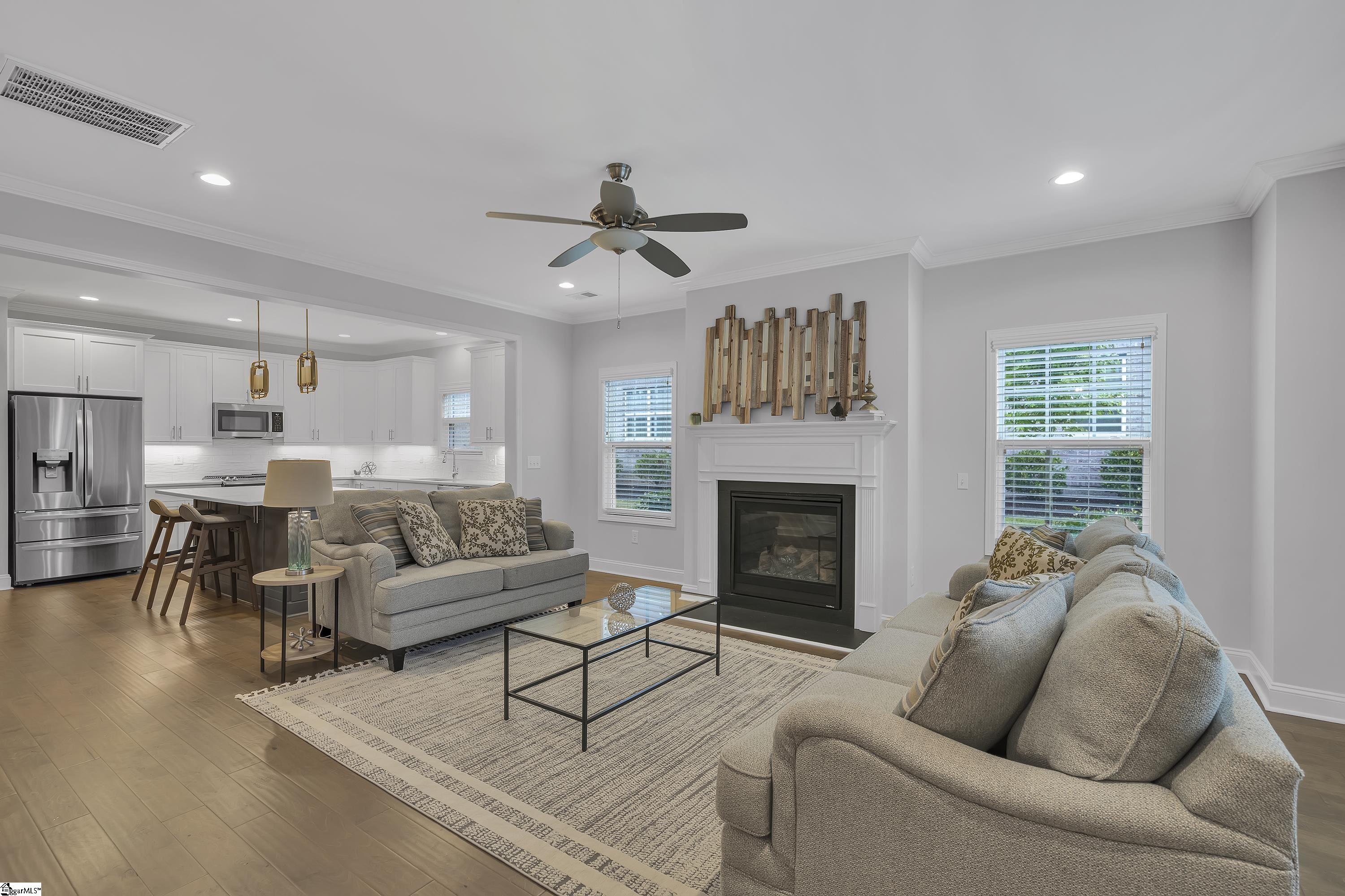 22 Peckham Street Greenville, SC 29607 - Photo 3 of 17 Welcoming living room with gas fireplace and upgraded surround