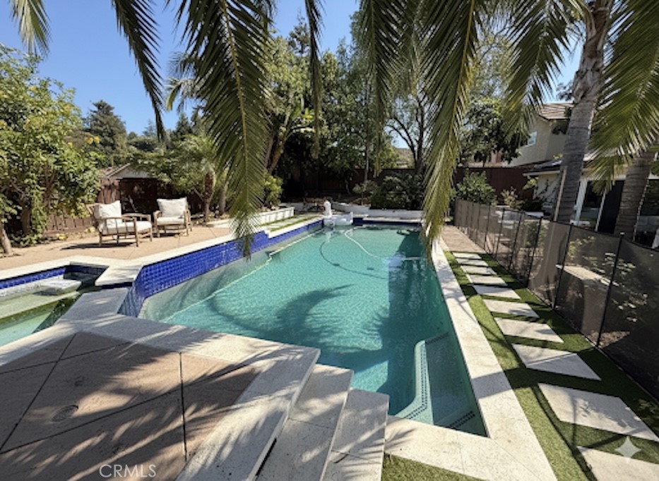 1690 Stoddard Avenue Thousand Oaks, CA 91360 - Photo 1 of 17 a view of a backyard with sitting area