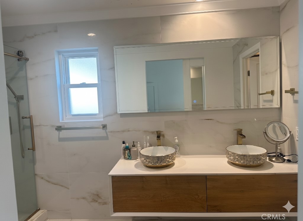1690 Stoddard Avenue Thousand Oaks, CA 91360 - Photo 11 of 17 a bathroom with a sink and a mirror