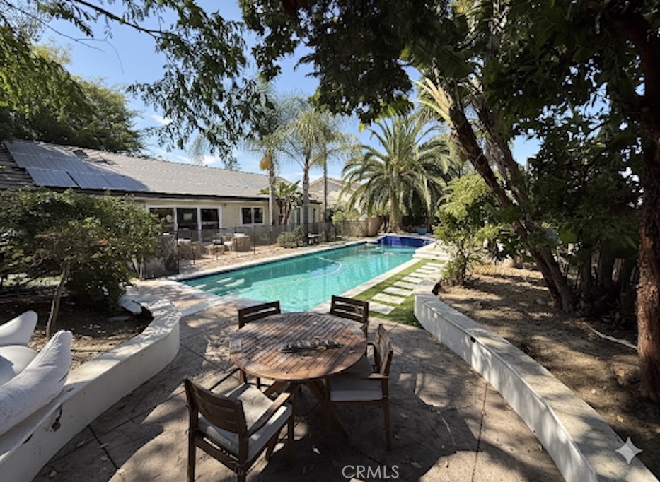 1690 Stoddard Avenue Thousand Oaks, CA 91360 - Photo 15 of 17 a view of backyard with swimming pool and outdoor seating