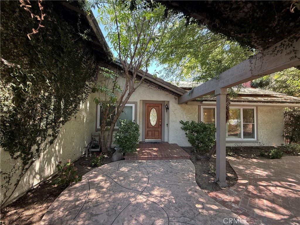 1690 Stoddard Avenue Thousand Oaks, CA 91360 - Photo 3 of 17 a front view of a house with yard