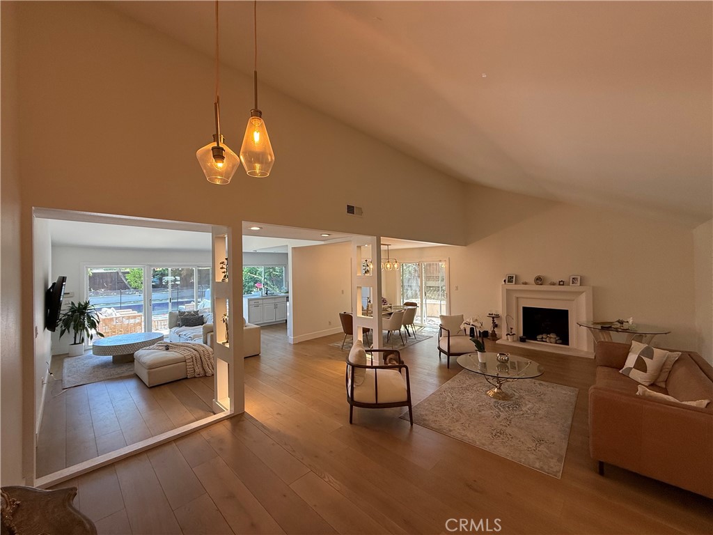 1690 Stoddard Avenue Thousand Oaks, CA 91360 - Photo 5 of 17 a living room with furniture a fireplace and a flat screen tv