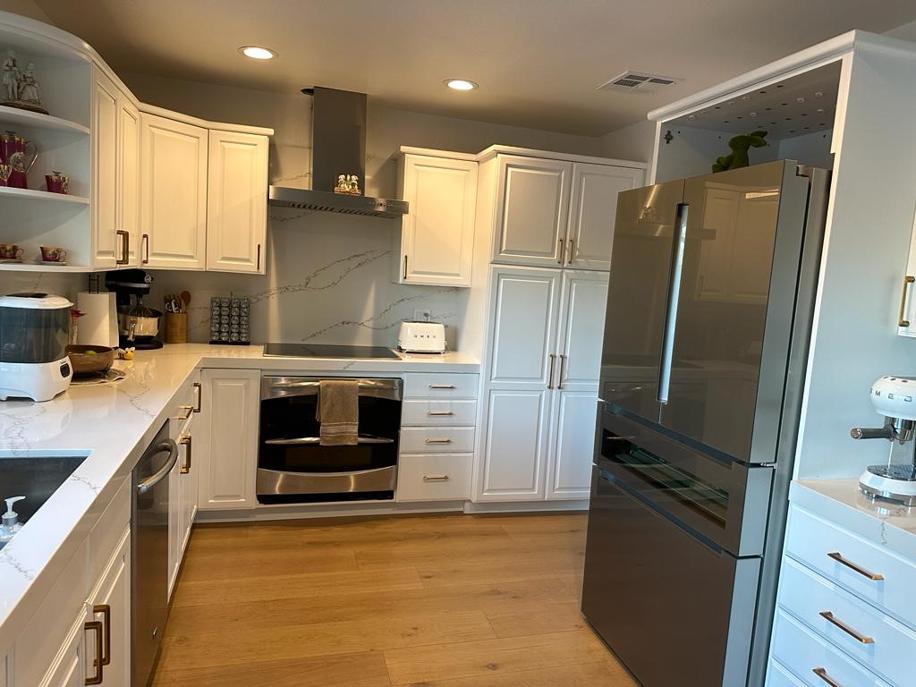 1690 Stoddard Avenue Thousand Oaks, CA 91360 - Photo 8 of 17 a kitchen with stainless steel appliances a refrigerator sink and stove