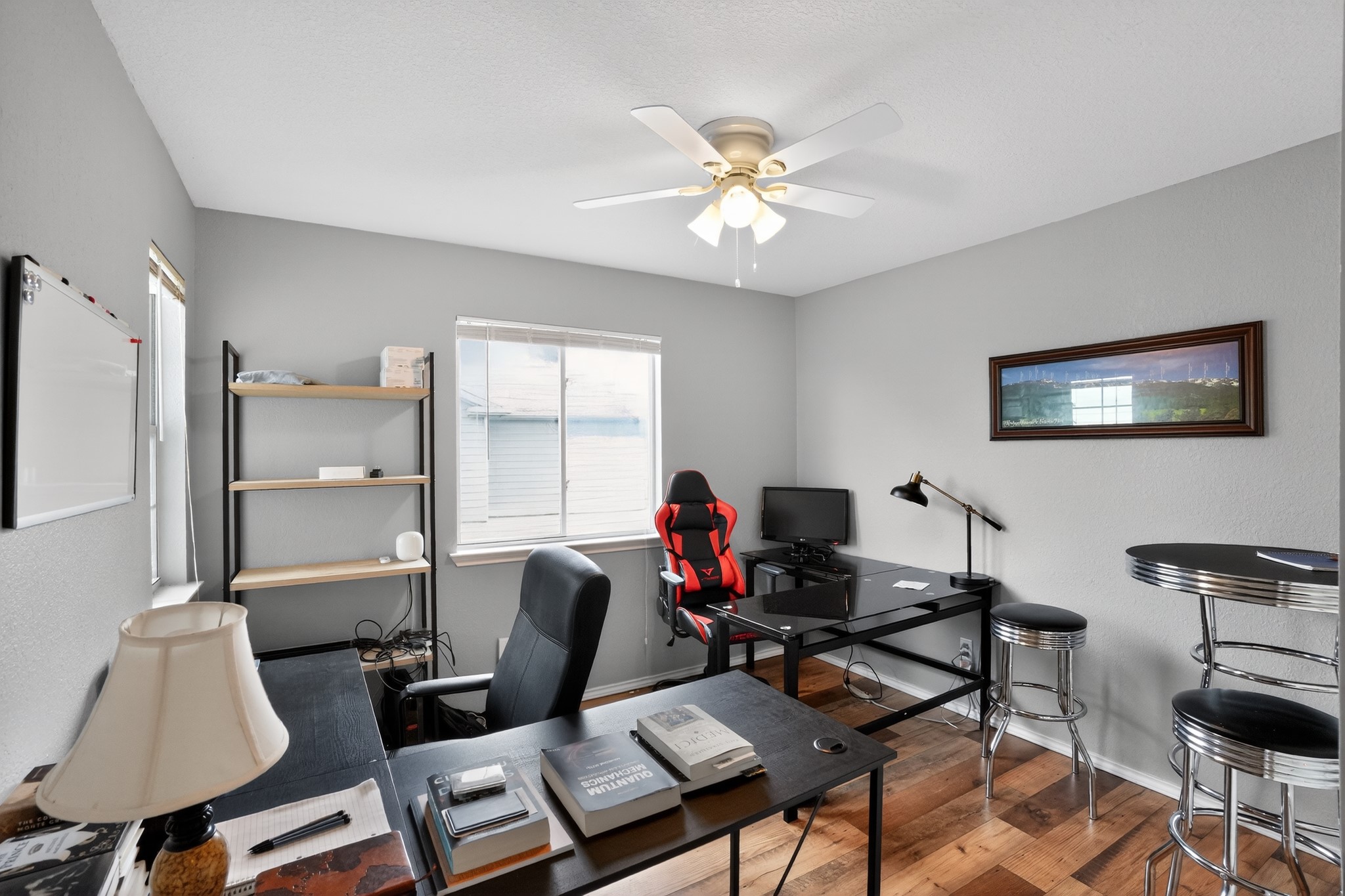 13808 Harris Ridge Boulevard Pflugerville, TX 78660 - Photo 30 of 40 a work room with furniture and wooden floor
