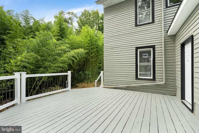 a terrace with trees in front of it