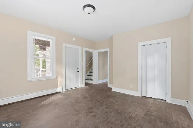 a view of an empty room with a window