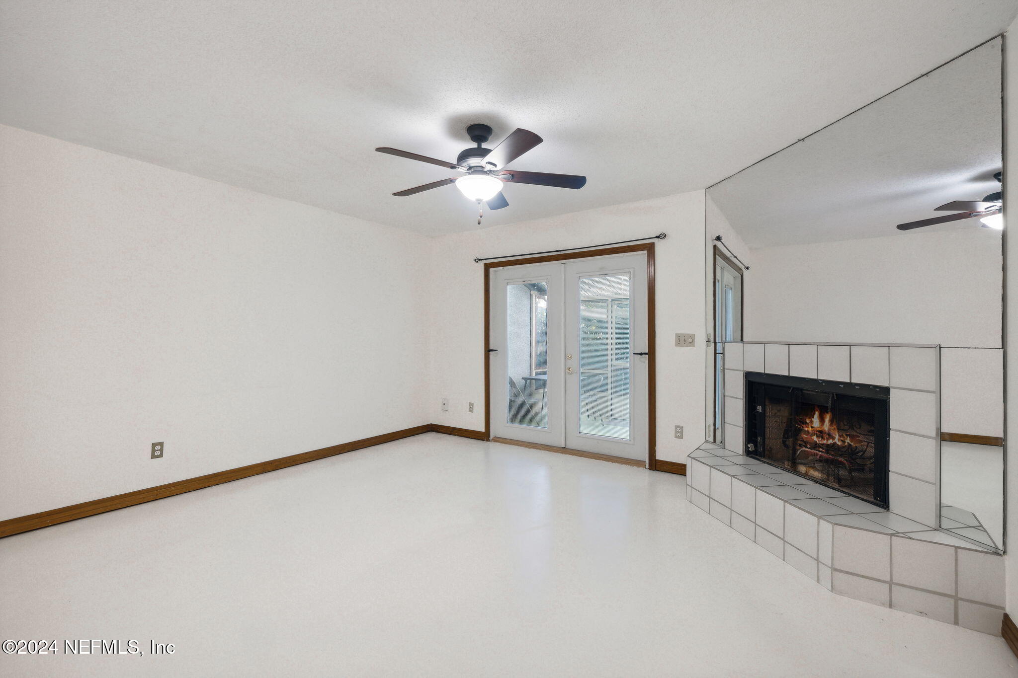 10800 Old St Augustine Road, Unit 204 Jacksonville, FL 32257 - Photo 13 of 31 Living room and fireplace