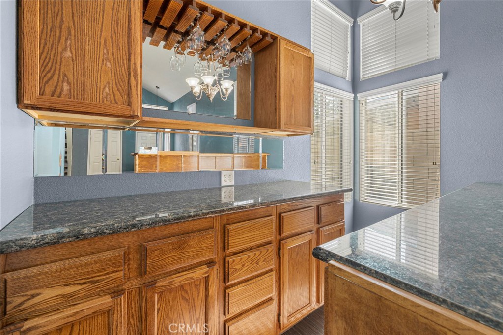 15417 Tobarra Road Fontana, CA 92337 - Photo 9 of 29 a kitchen with stainless steel appliances granite countertop a sink and a window