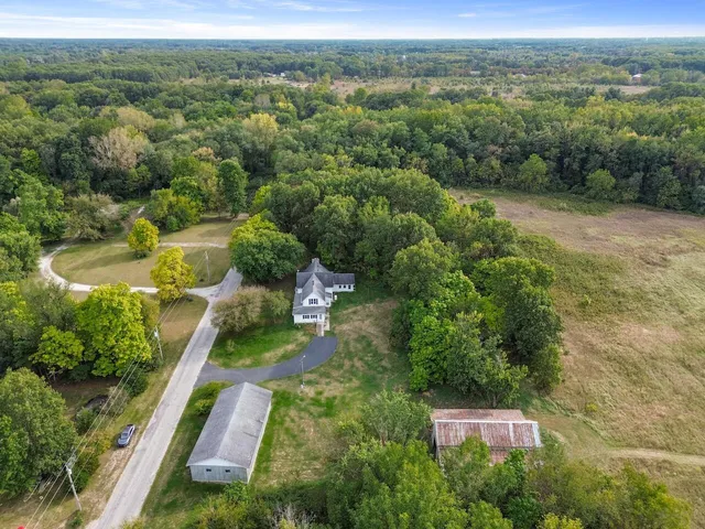 an aerial view of residential house with outdoor space