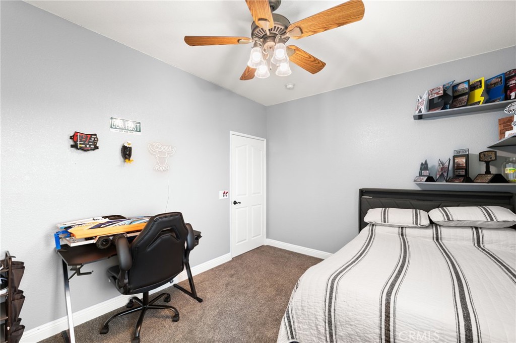 35443 Schafer Ranch Road Yucaipa, CA 92399 - Photo 33 of 67 a bedroom with a bed and a chair