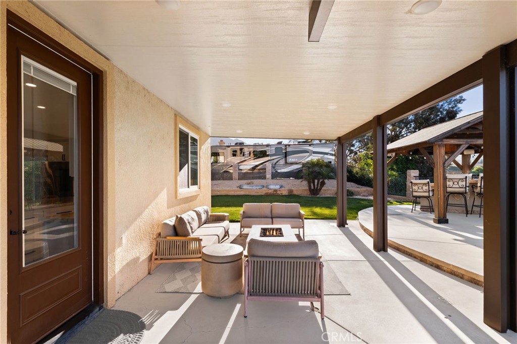35443 Schafer Ranch Road Yucaipa, CA 92399 - Photo 49 of 67 a view of a patio with a dining table and chairs