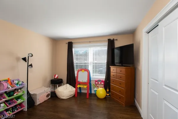 a room with toys and dresser