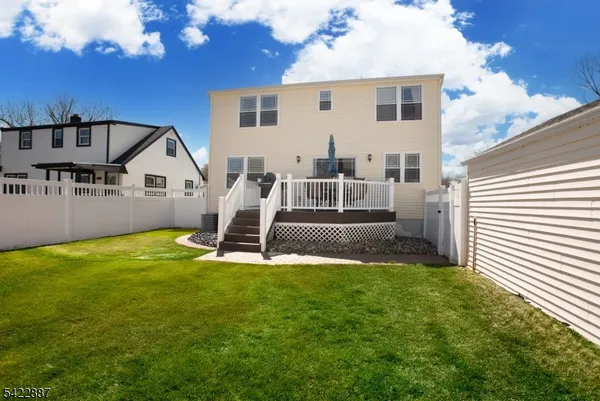 a view of a house with a backyard porch and sitting area