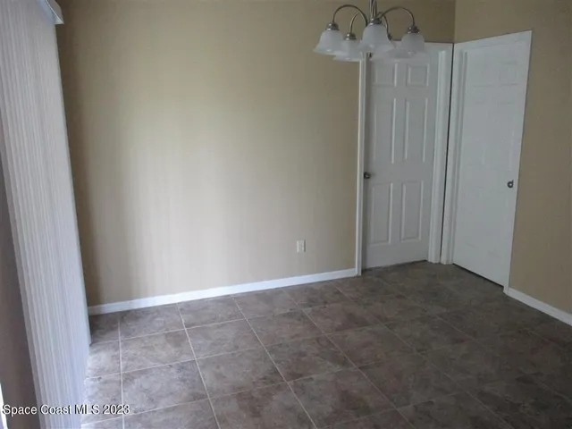 a kitchen with granite countertop a sink stove and refrigerator