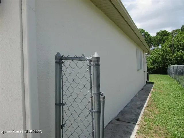 a view of an empty room and balcony