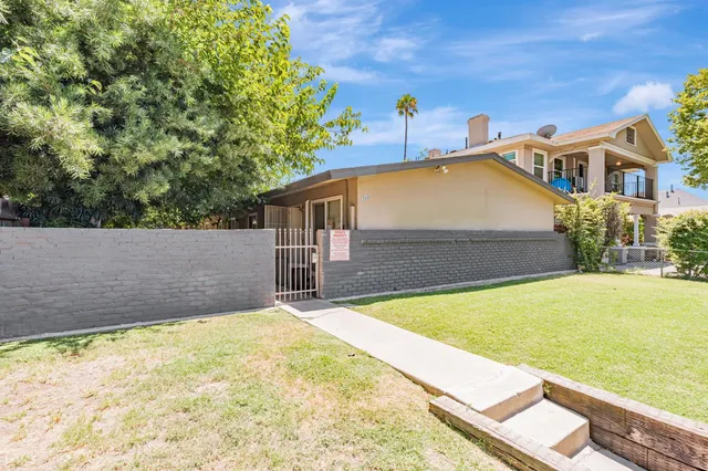a view of a backyard with a small pool