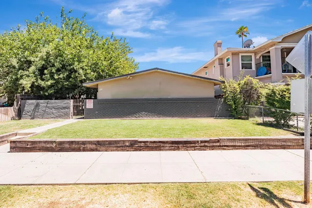 a house with trees in front of it