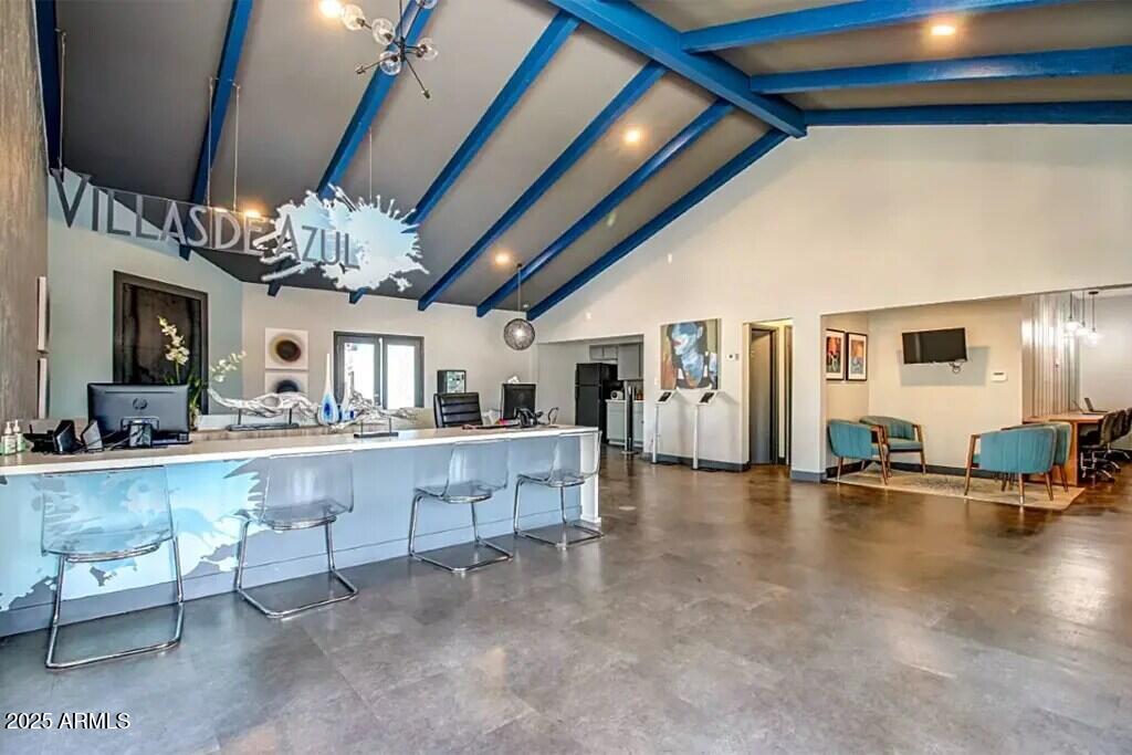 2627 North 45th Avenue, Unit 2C Phoenix, AZ 85035 - Photo 16 of 29 a view of a living room and chandelier