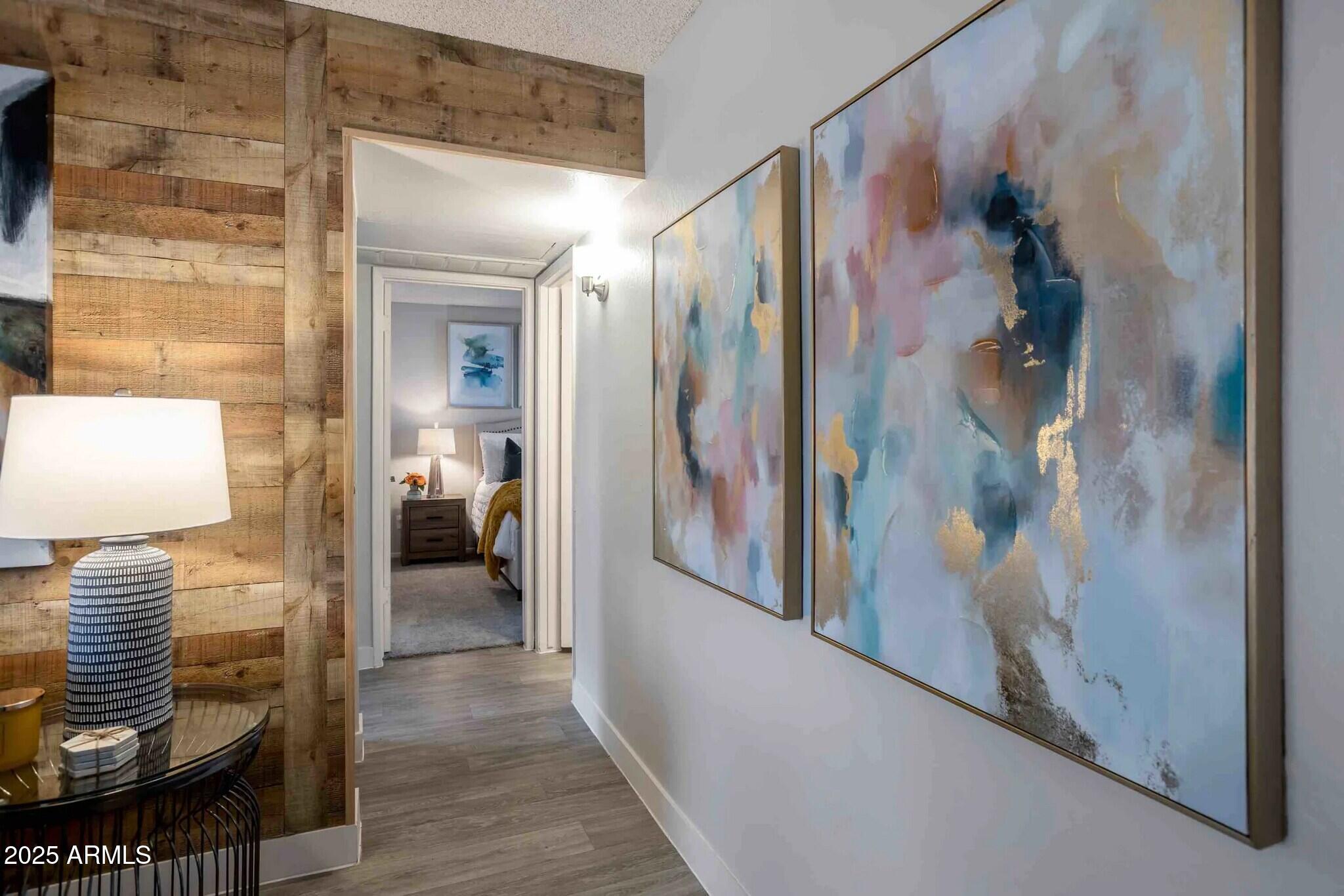 2627 North 45th Avenue, Unit 2C Phoenix, AZ 85035 - Photo 6 of 29 a view of hallway with livingroom and furniture