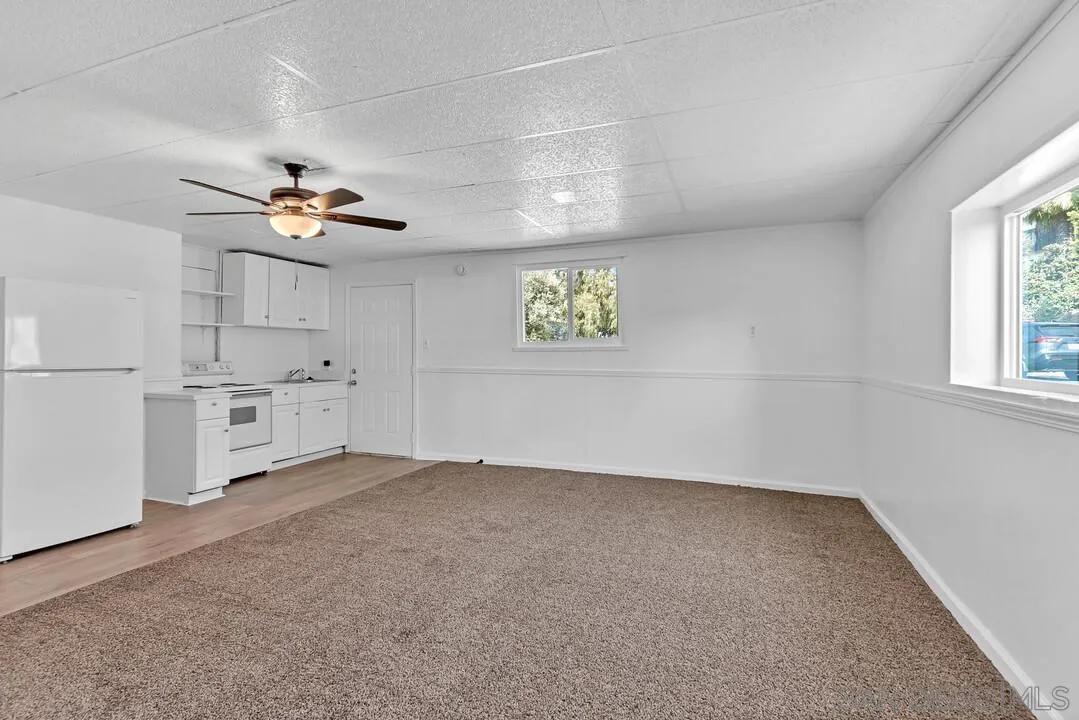 7901 Hillside Drive La Mesa, CA 91942 - Photo 11 of 52 an empty room with windows and fan