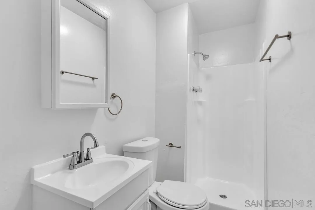 7901 Hillside Drive La Mesa, CA 91942 - Photo 13 of 52 a bathroom with a sink a toilet and shower