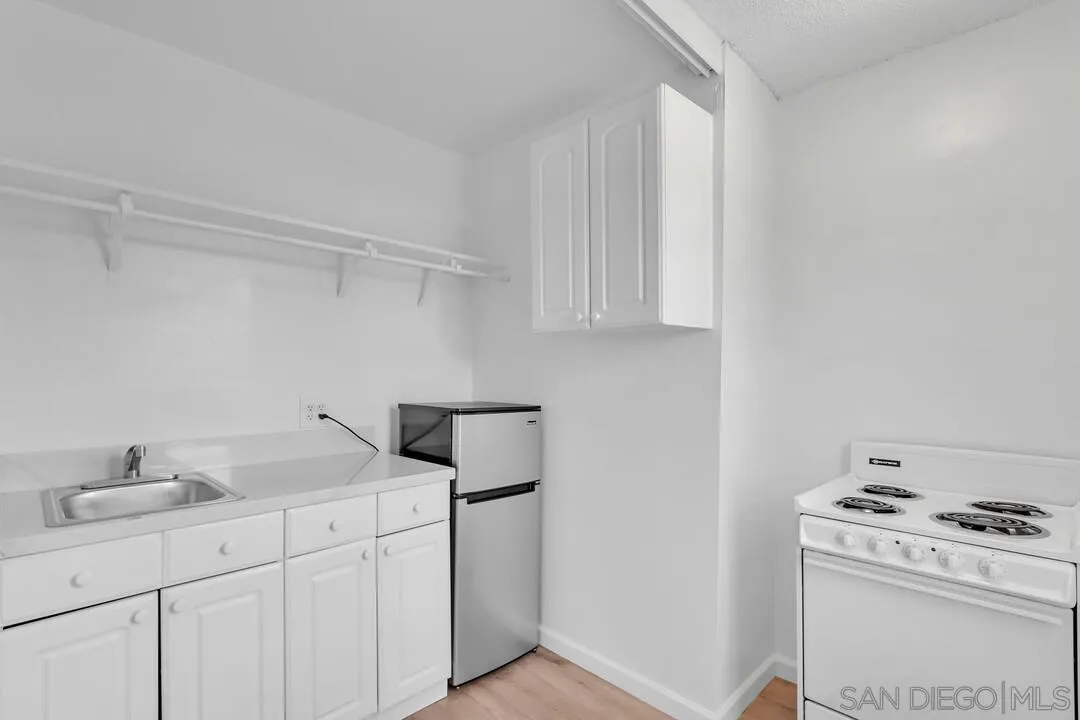 7901 Hillside Drive La Mesa, CA 91942 - Photo 35 of 52 a utility room with cabinets washer and dryer