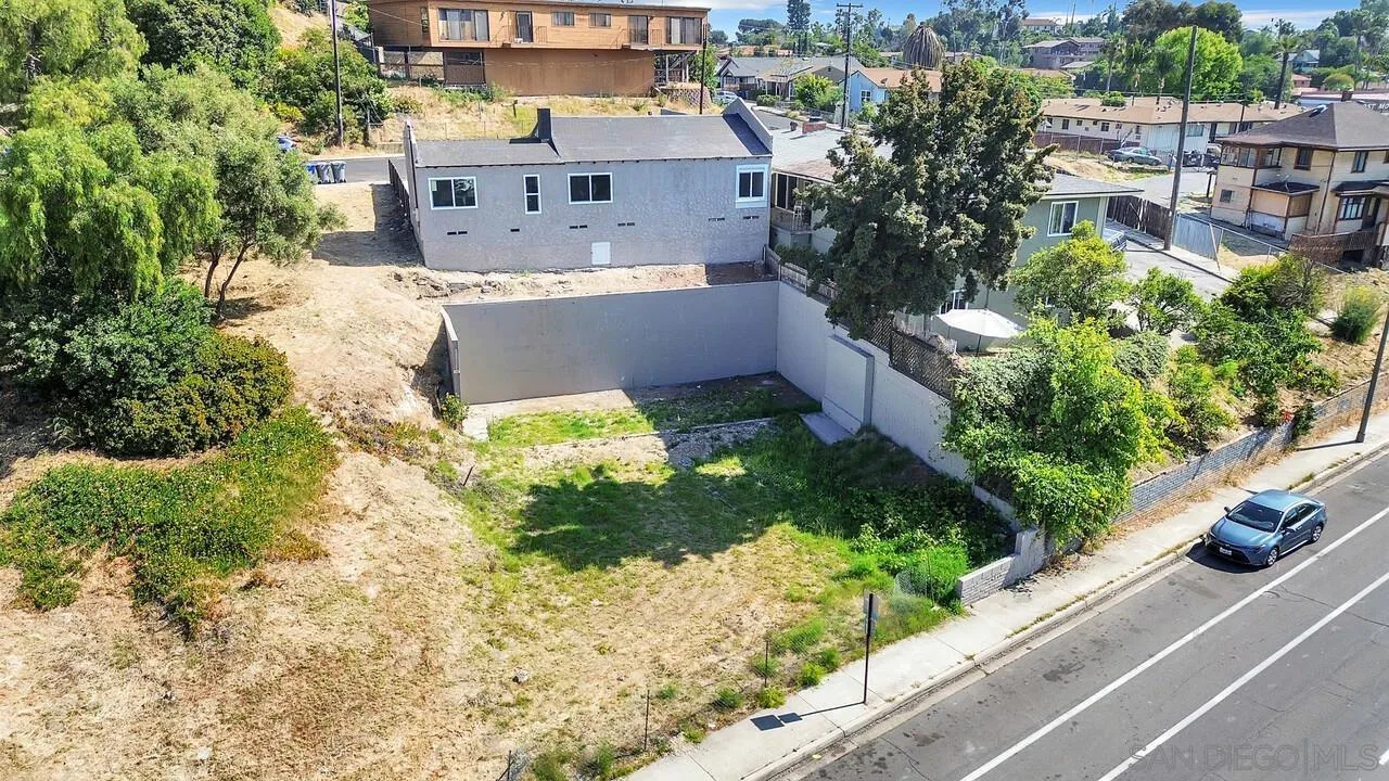 7901 Hillside Drive La Mesa, CA 91942 - Photo 52 of 52 a view of a house with a yard and a wooden fence