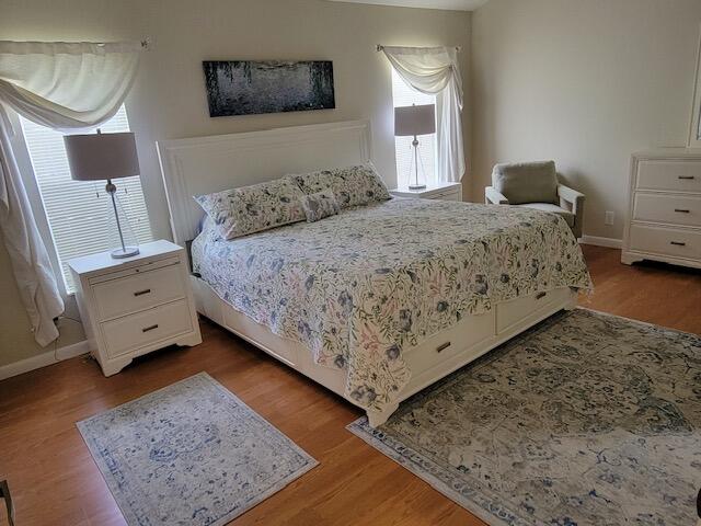 1008 Ocean Dunes Circle Jupiter, FL 33477 - Photo 4 of 19 a bedroom with a bed and window