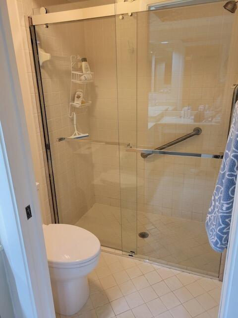 1008 Ocean Dunes Circle Jupiter, FL 33477 - Photo 7 of 19 a bathroom with a shower and a toilet