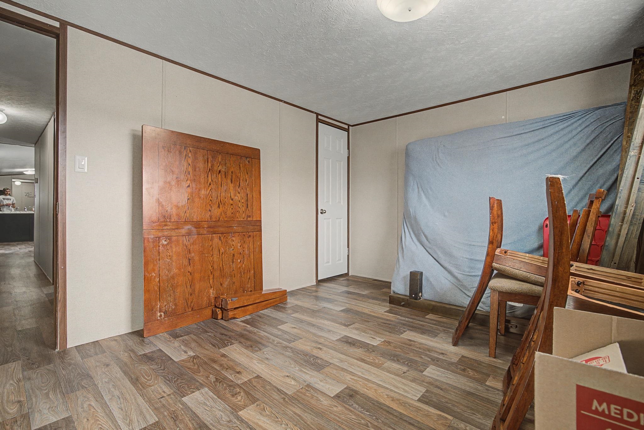 269 Clements Way Fruita, CO 81521 - Photo 11 of 20 a view of a livingroom with wooden floor and closet