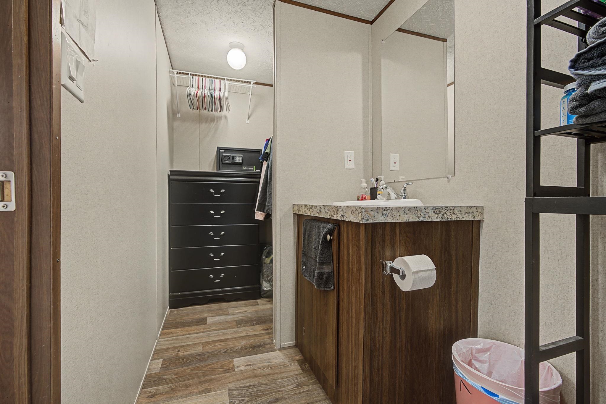 269 Clements Way Fruita, CO 81521 - Photo 16 of 20 a bathroom with a sink a mirror and a shower