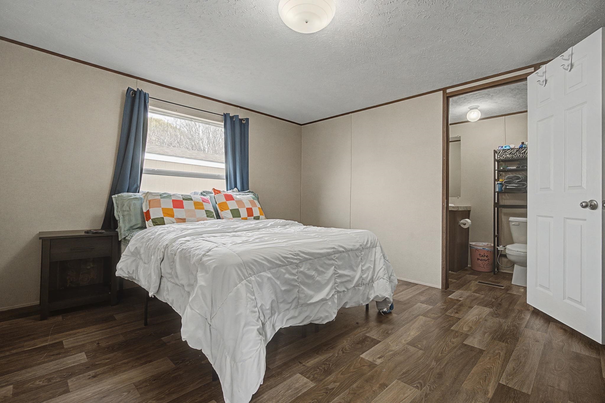 269 Clements Way Fruita, CO 81521 - Photo 19 of 20 a bedroom with a bed and a window