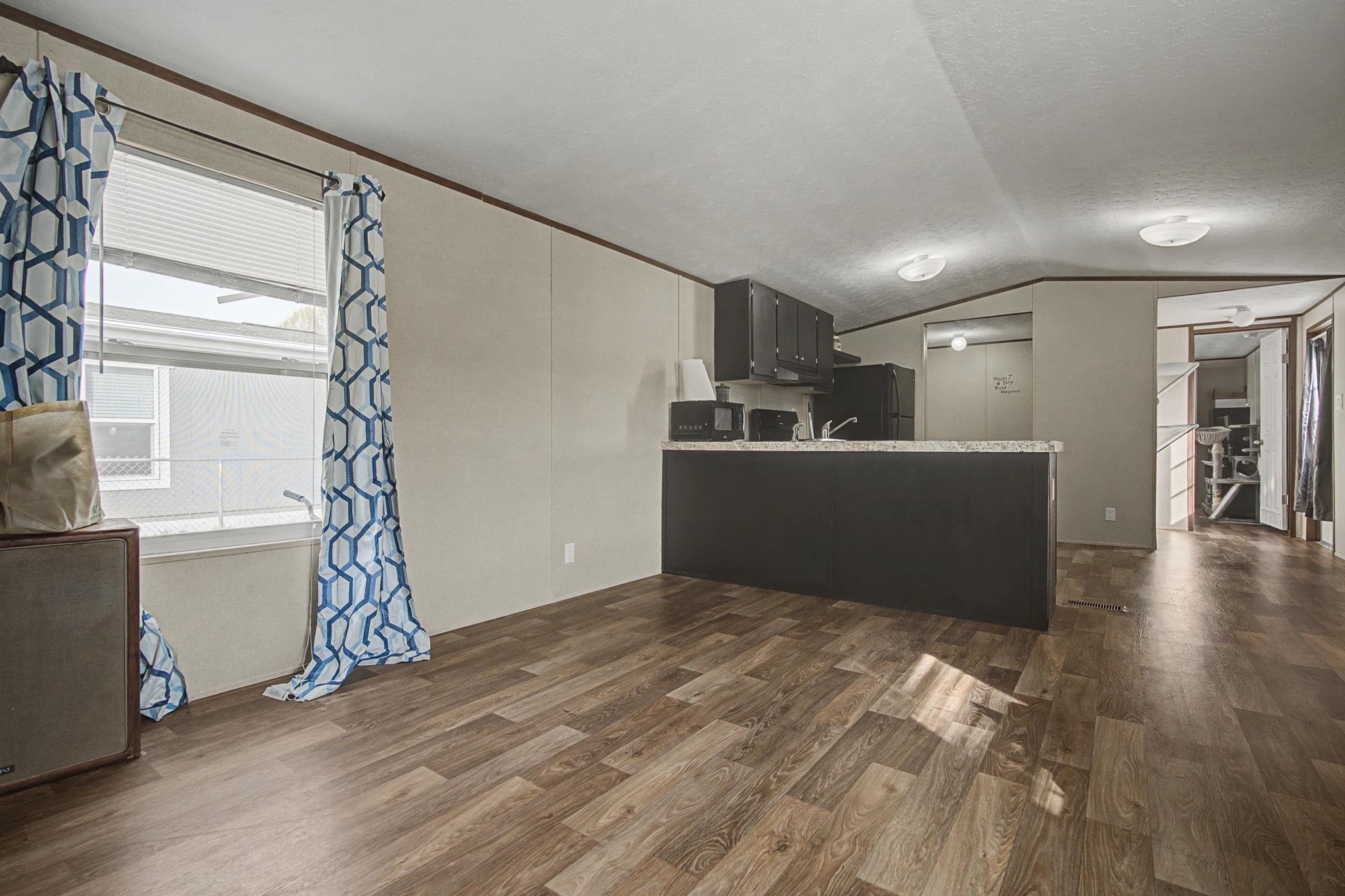 269 Clements Way Fruita, CO 81521 - Photo 8 of 20 a view of a livingroom with wooden floor