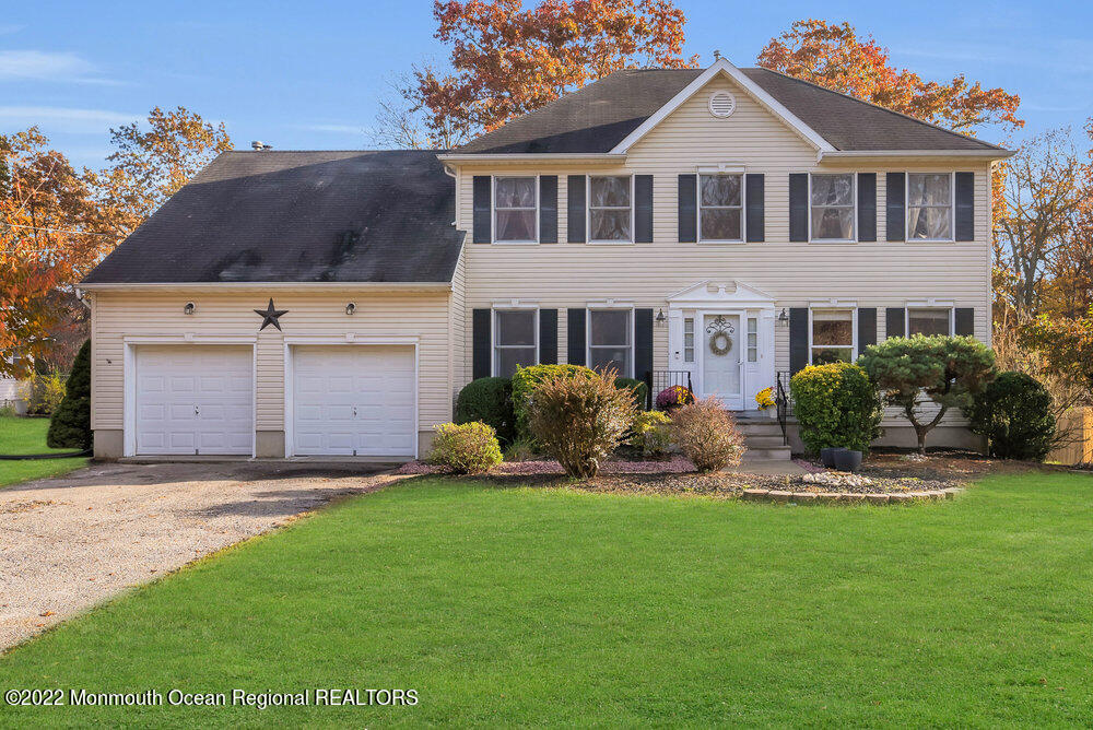 897 Bethel Church Road Jackson, NJ 08527 - Photo 1 of 1 a front view of a house with a yard and potted plants