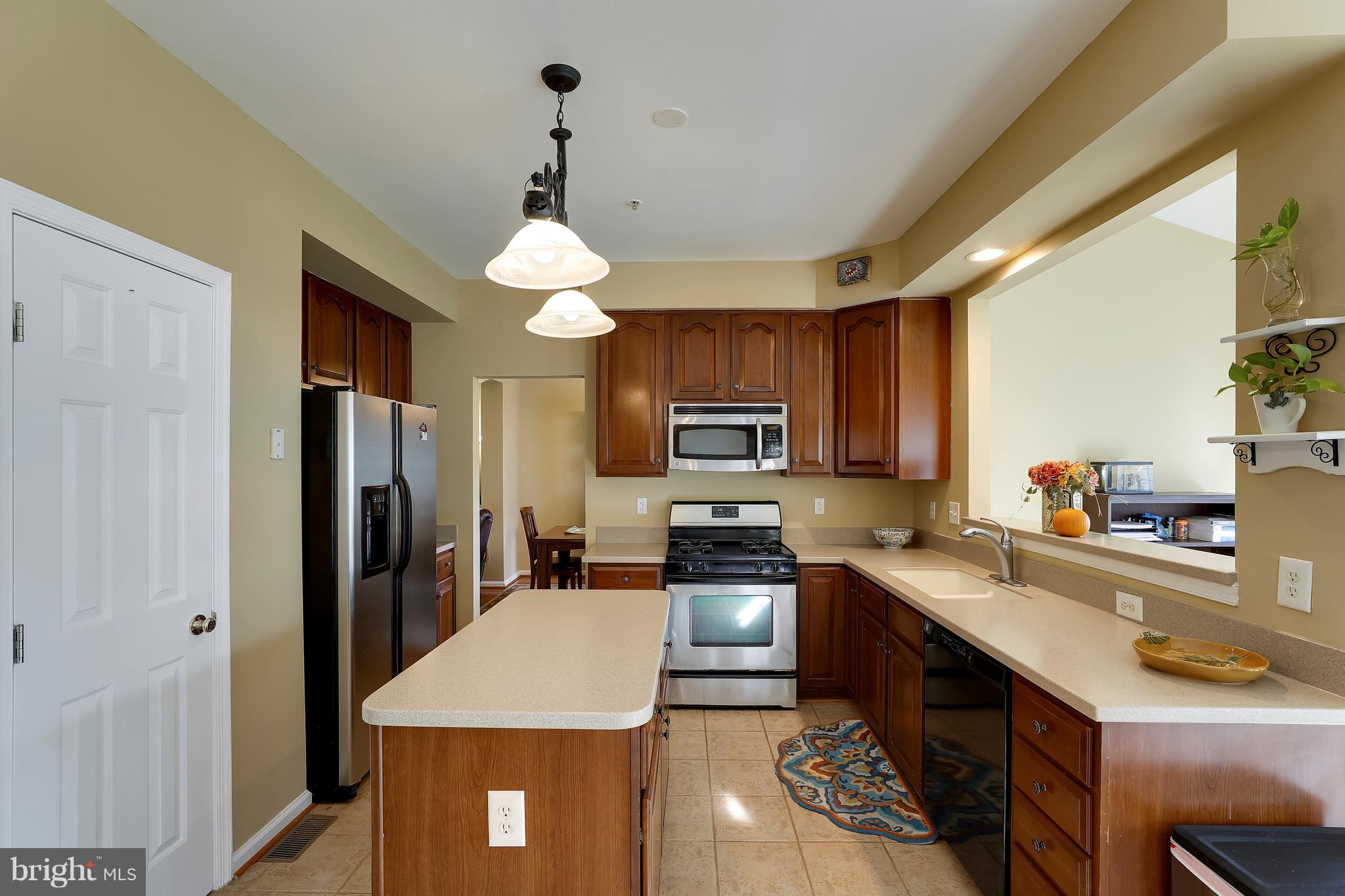 12007 Backus Drive Bowie, MD 20720 - Photo 18 of 75 Built-In Microwave and Kitchen Island