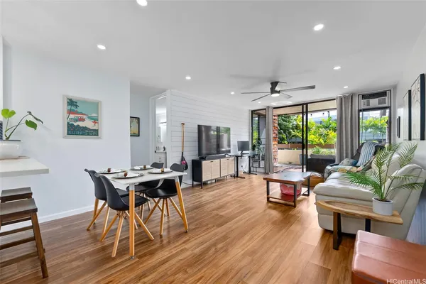 a view of a dining room with furniture window and wooden floor