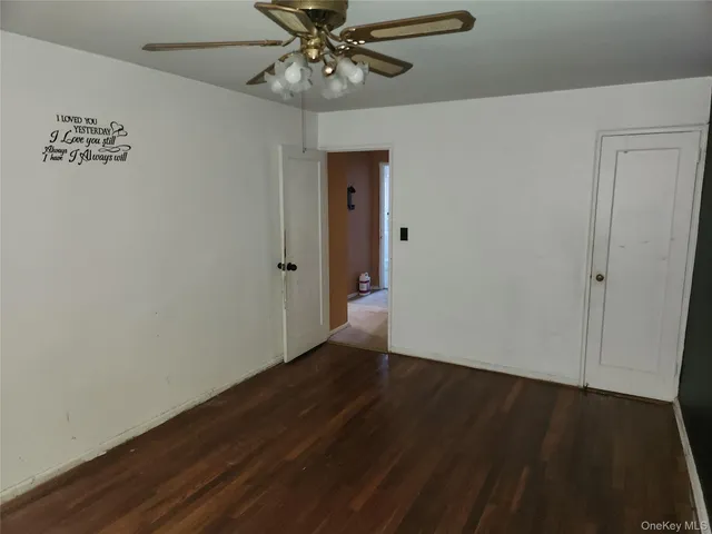 a view of a livingroom with furniture and a flat screen tv