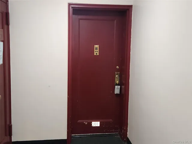 a view of a room with furniture and a chair