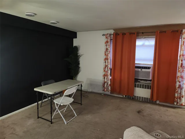 a view of hallway with wooden floor