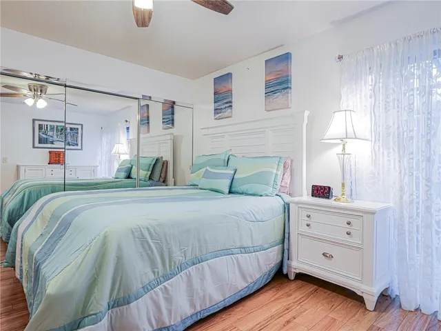 a bedroom with bed and window