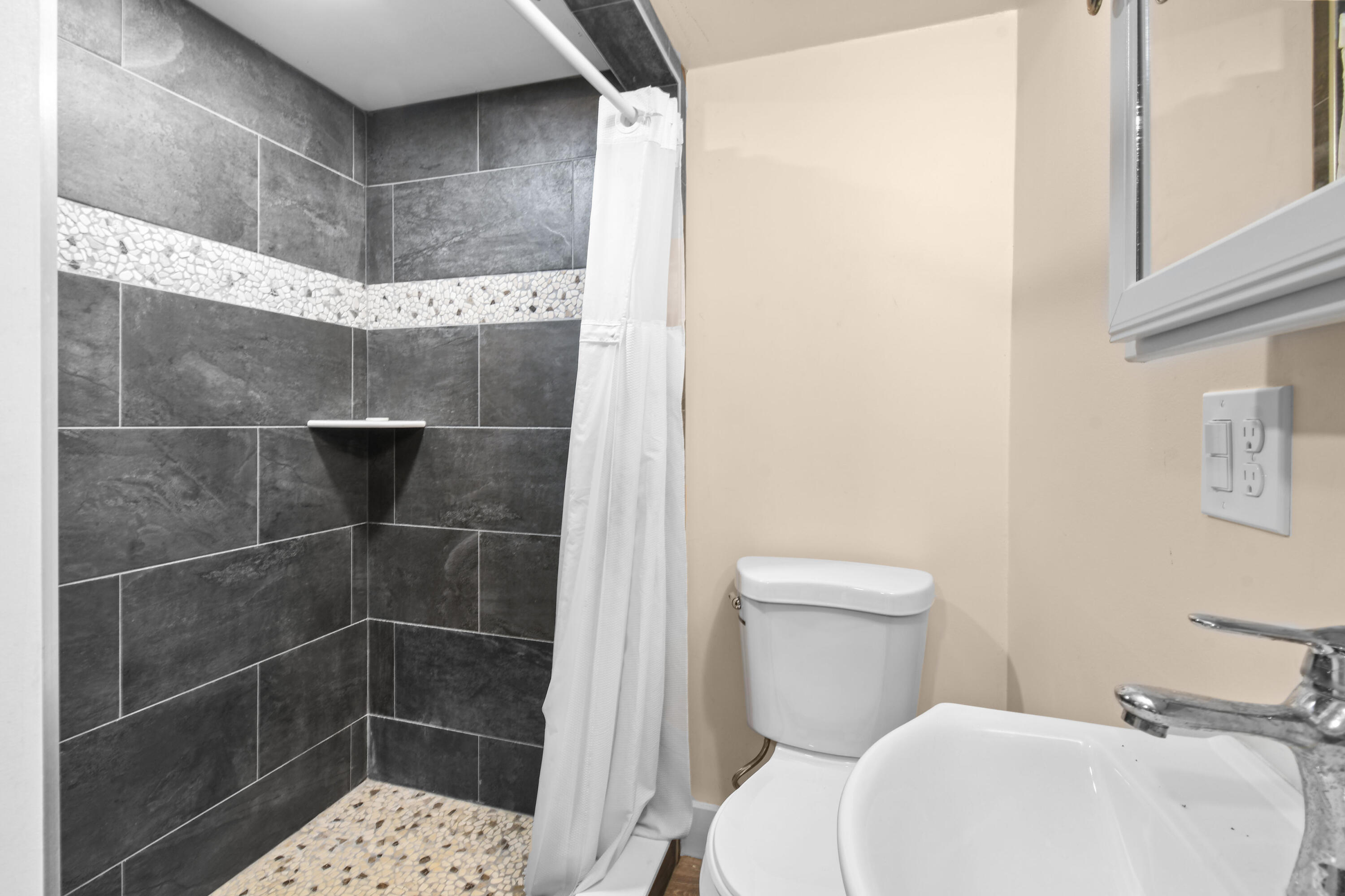 5782 Russakis Road Fort Pierce, FL 34951 - Photo 55 of 90 a bathroom with a toilet and a shower