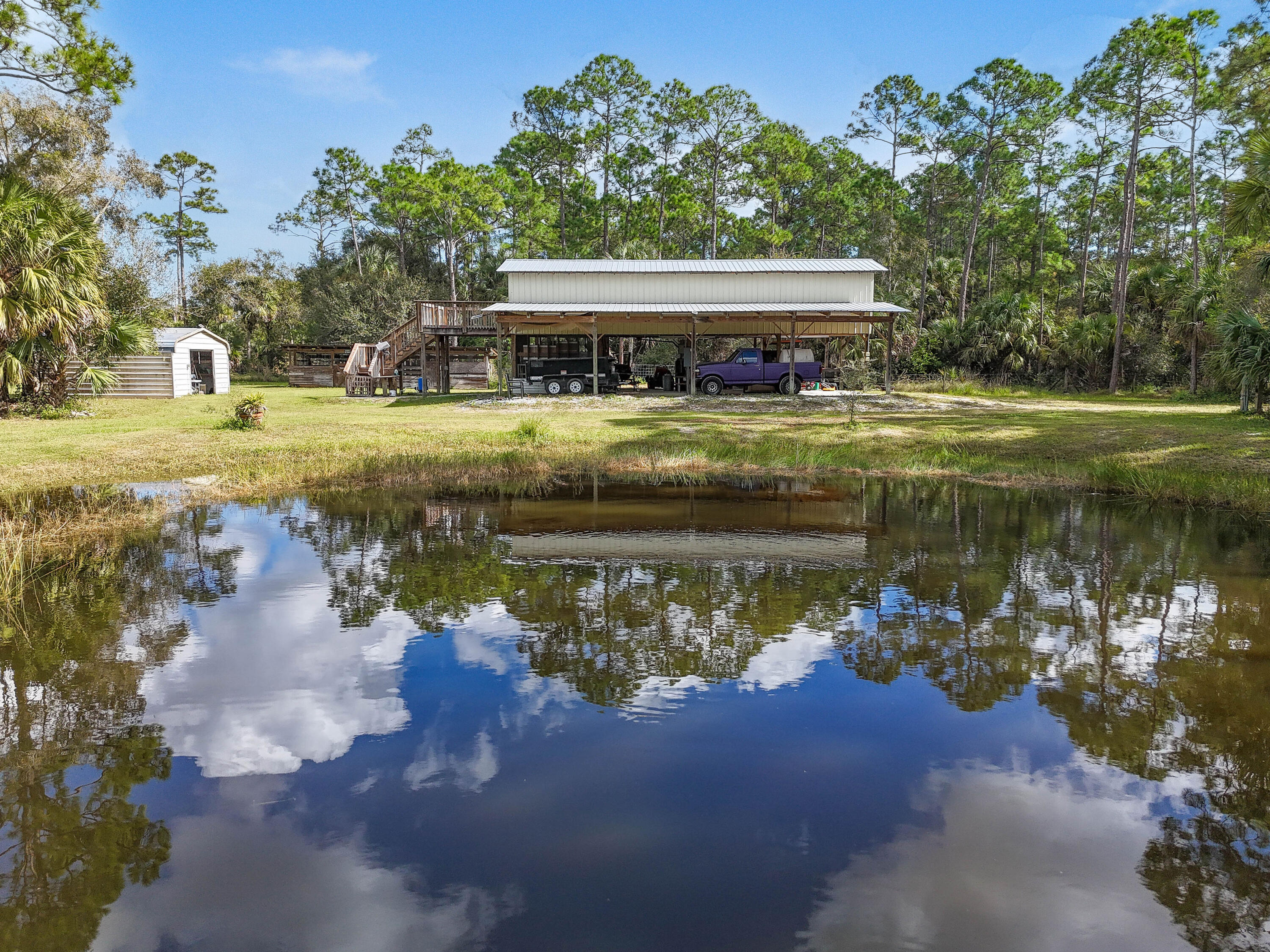 5782 Russakis Road Fort Pierce, FL 34951 - Photo 89 of 90 a front view of a house with a lake view