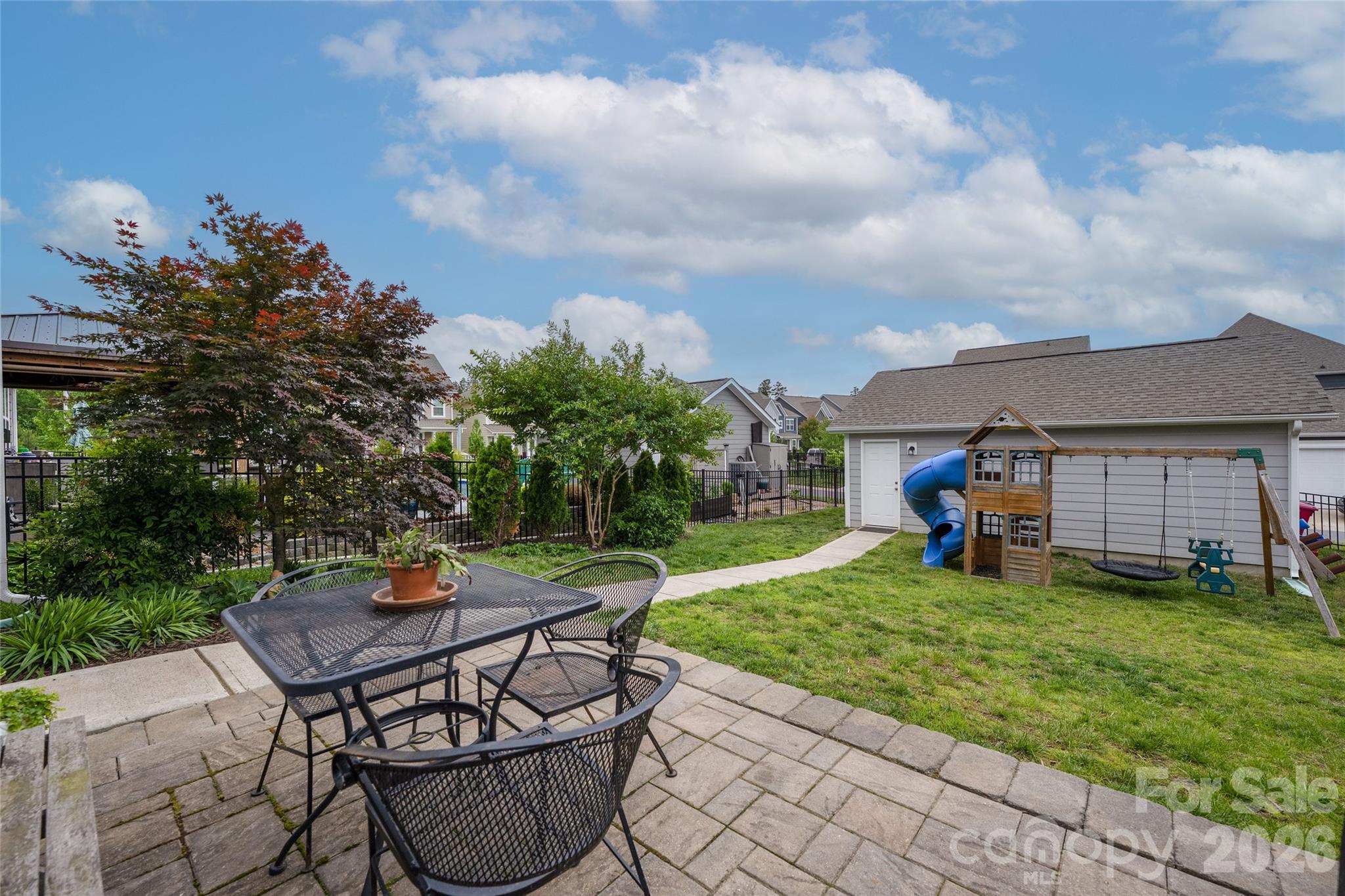 17219 Shearer Road Davidson, NC 28036 - Photo 28 of 34 a view of a backyard with table and chairs and potted plants